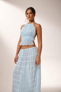 Miraee Paris light blue two-piece set featuring a pleated chiffon halter top and matching maxi skirt with lace trim.