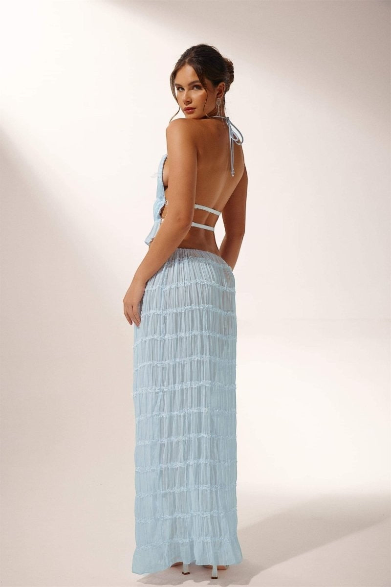 Miraee Paris light blue two-piece set with a pleated halter top and matching maxi skirt in airy chiffon fabric.