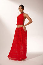 Miraee Paris red two-piece set featuring a pleated halter top and matching flowing maxi skirt in lightweight chiffon.